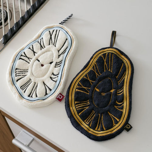 Two decorative hand towel with clock designs on a white surface.